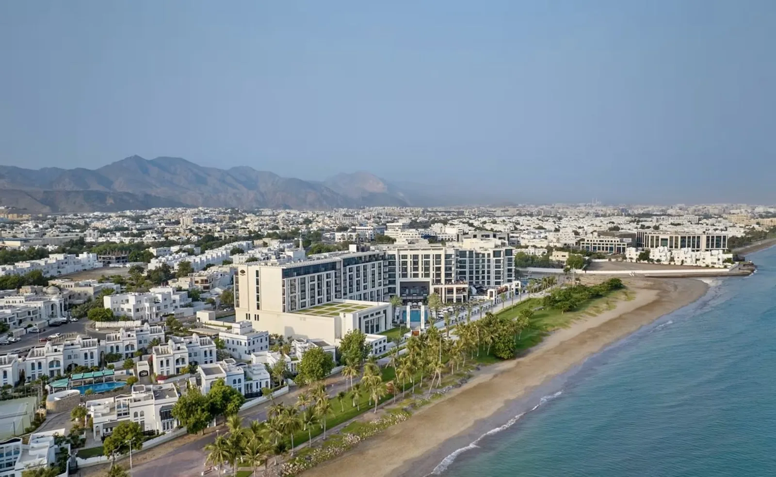 Shatti Al Qurum beachfront with the residences and Muscat's mountains