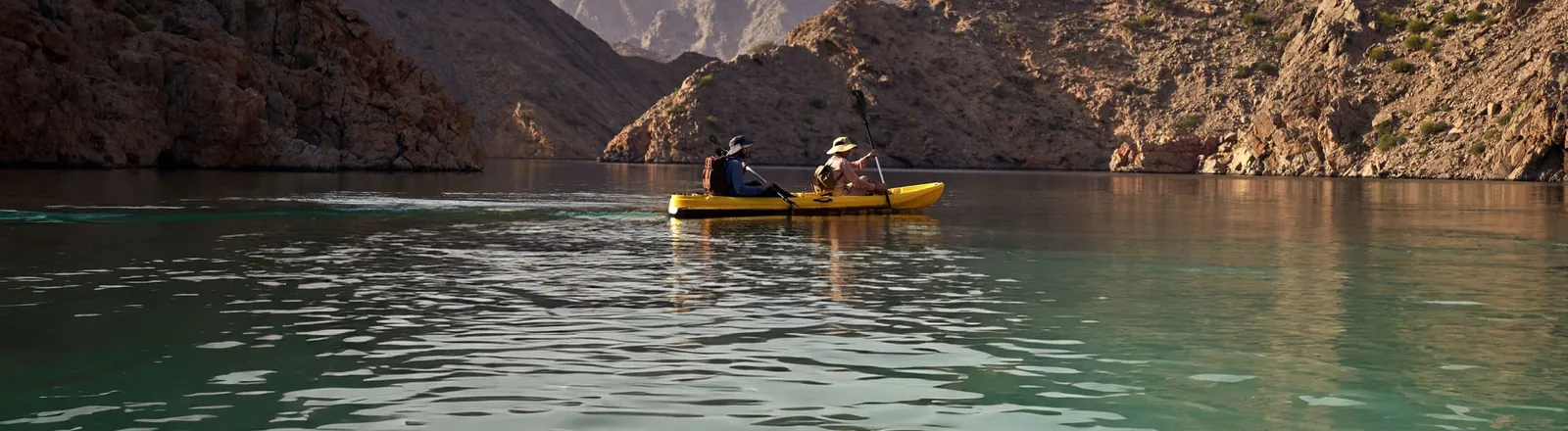 Kayaking on the Yiti coastline between the mountains and the Sea of Oman